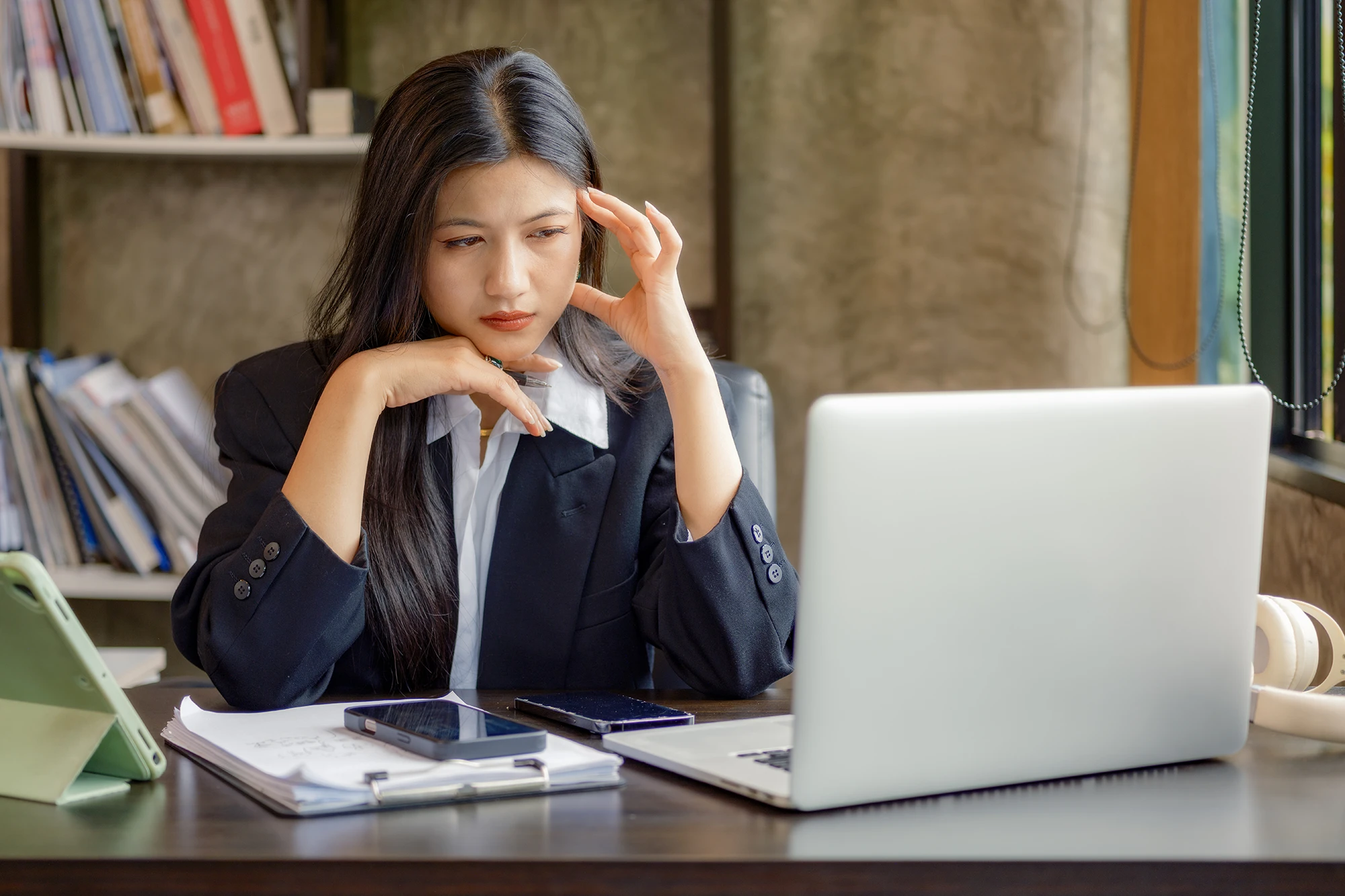 asian woman office worker looking at computer